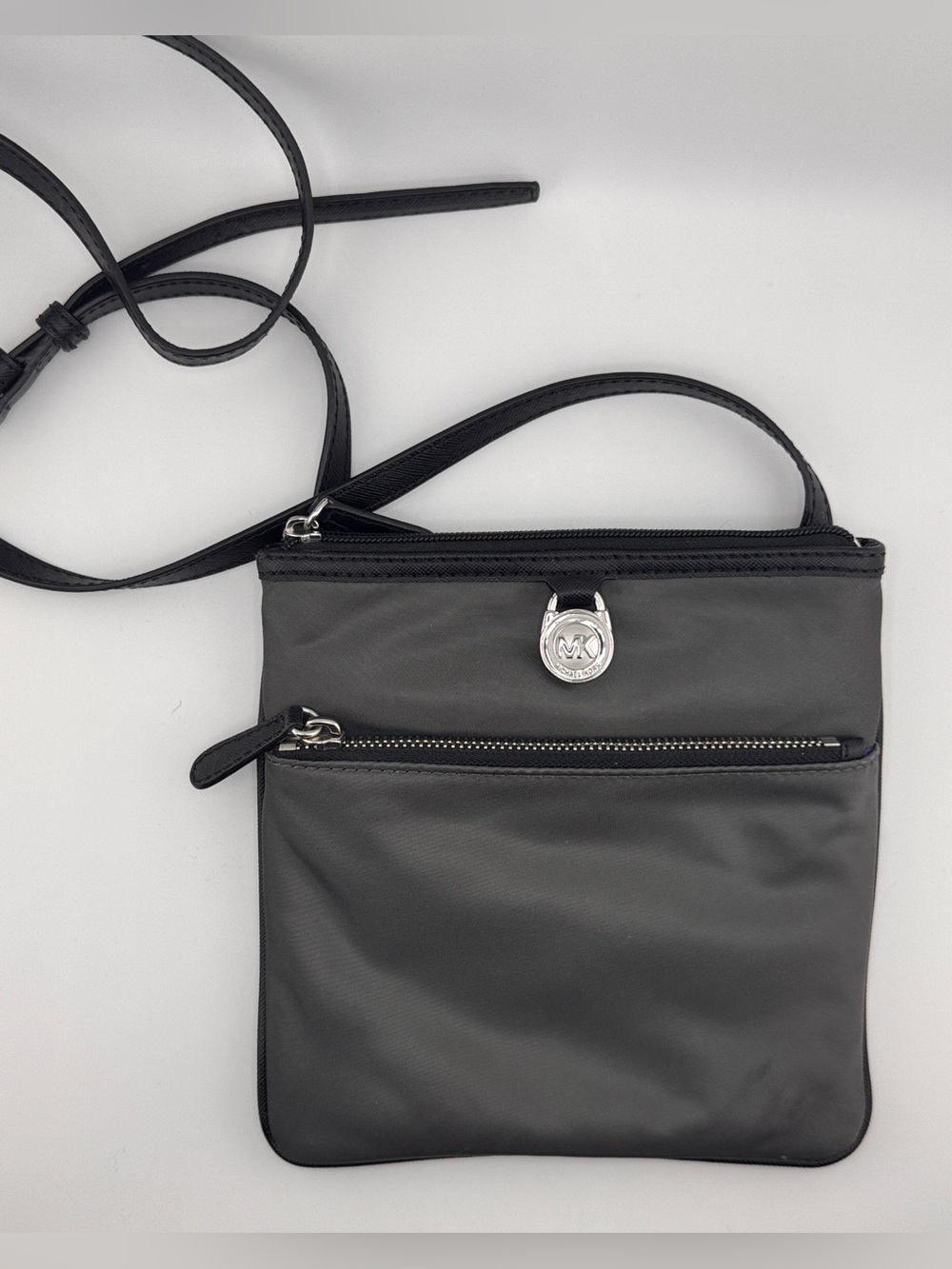 Michael Kors Gray with Black trim Nylon Crossbody bag with Silver MK Logo Charm